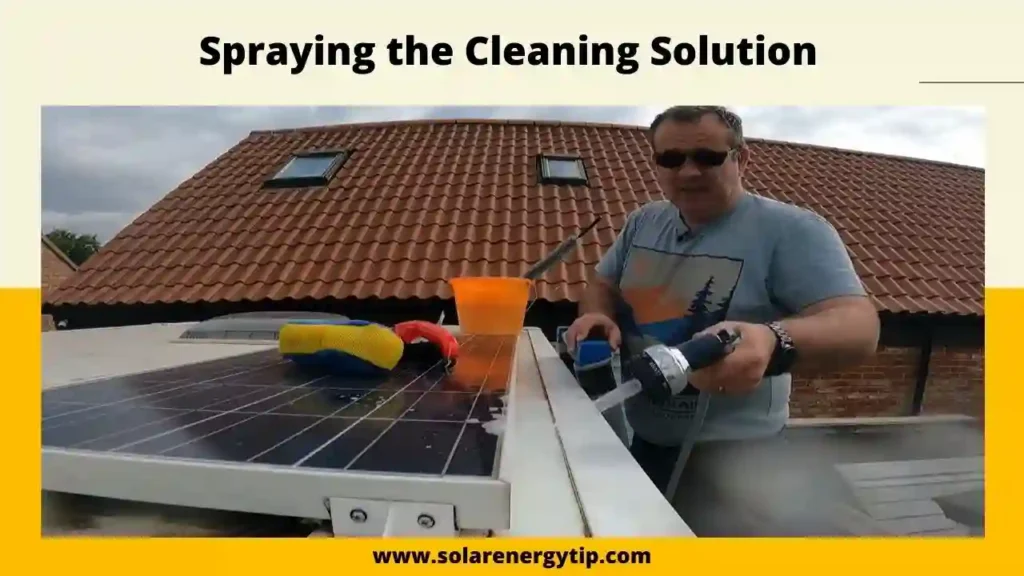 Spraying the Cleaning Solution Under side of Solar Panels